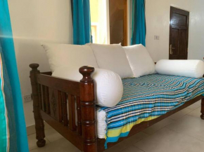 Breezy African inspired two bedroom flat.